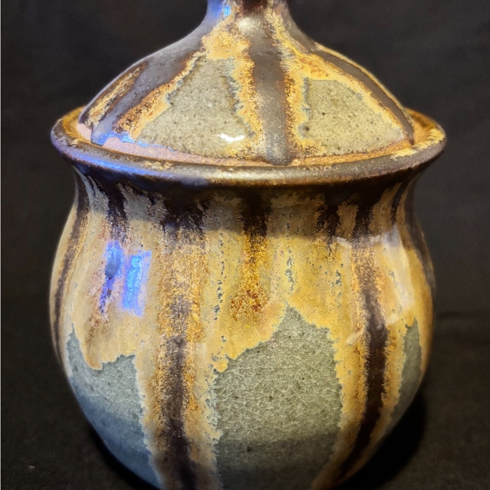 Pottery Lidded Jar Earthy tones with a bohemian feel, often used for decorative